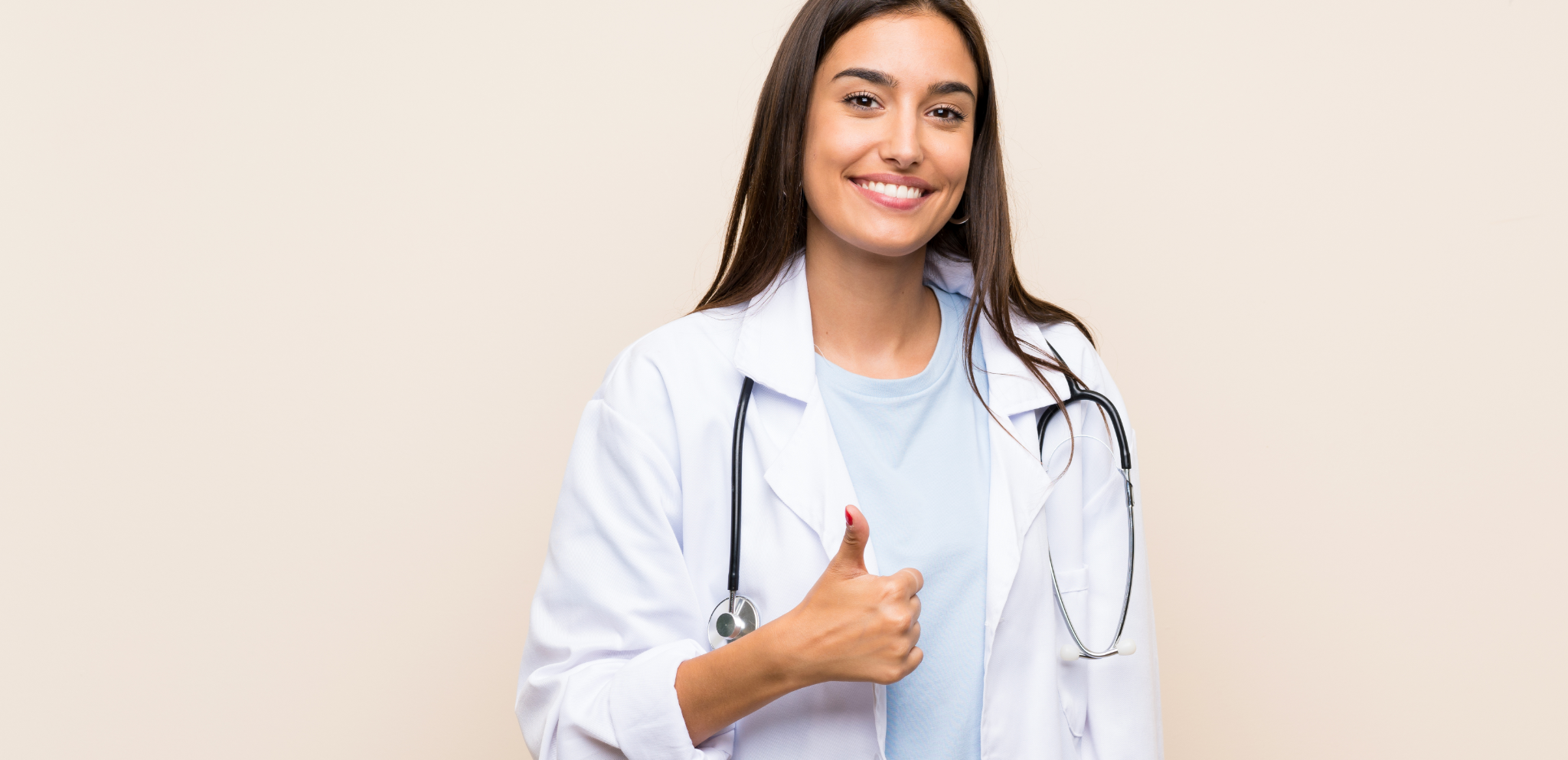 Female doctor giving thumbs up