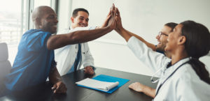 Locum tenens doctors and advanced practitioners high fiving